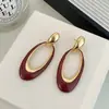 Brincos Europeus e Americanos Exagerados de Metal Oval com Esmalte de Gotejamento para Mulheres Luxo Leve Design de Nicho Brincos de Moda de Alta Qualidade