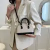Moda Primavera 2026 Gran Capacidad Moderno Texturizado Color Bloque Elegante Tejido Popular Bolso de Hombro Cruzado Bolso tipo Concha