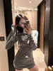 Camiseta de manga larga gruesa y cálida con cuello redondo para mujer, prenda interior o exterior, nuevo estilo de primavera y otoño, longitud media que cubre los glúteos, top ajustado