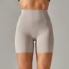 Pantalones de yoga de estilo nuevo sin línea de vergüenza color piel para mujer, cintura alta, realce de glúteos, compresión abdominal, shorts deportivos de tres puntos