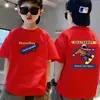 Camiseta de algodón puro de manga corta para niños, nuevo estilo de verano con estampado de letras de dibujos animados, top holgado de moda para bebé de media manga