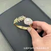 Nuevo traje incrustado de piedra de cristal en polvo de perla barroca personalidad moda lujo suministro de fábrica venta al por mayor juego de cuatro piezas