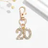 Bestseller transfronteiriço europeu e americano: Lindo mini chaveiro feminino com números da sorte 1-25 cravejados de diamantes, decoração de pingente para bolsa