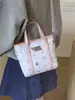 Bolso Cubo de Gran Capacidad Transfronterizo para Mujer 2026 Nuevo Bolso de Mano con Estampado de Dibujos Animados Bolso de Hombro Cruzado de Alta Gama para Viajes