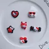Año Nuevo Navidad gato negro rojo hueso diy pegamento de crema funda para teléfono móvil hebilla de zapato pasador accesorios de resina al por mayor
