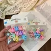 Lindos pasadores de flores estilo coreano para niños en colores de caramelo, versátiles para recoger el cabello suelto, no dañan, perfectos para sesiones de fotos