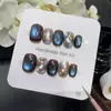 Patrón Ola de EstrellaMar Nocturno Ojo de Gato Uñas Artísticas Azul y Negro Degradado Patrón a Cuadros con Brillantes Pedrería y Nebulosa Uñas Portátiles Hechas a Mano