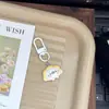 Chaveiro fofo de desenho animado de foca adorável, bolinho de pudim, charme feminino para mochilas de estudantes, presente para melhores amigos