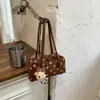 Bolso de lunares de nicho transfronterizo para mujer, nuevo bolso versátil simple para hombro o axila de otoño 2026, bolso de mano de moda retro