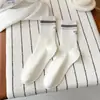 Calcetines sin costuras 2026 para mujer, calcetines de algodón de media pantorrilla para primavera con rayas bordadas en el talón, calcetines holgados estilo coreano sin costuras