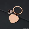 Llavero de Pata de Perro Hueca Transfronterizo Metal Forma de Corazón Impresión Láser Color Material en Blanco Regalo de Vacaciones Llavero Grabado