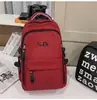 Mochila de viaje versátil estilo coreano para parejas con bordado de letras, mochila escolar elegante y duradera para chicos de secundaria y preparatoria