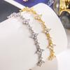 Pulsera Trébol de Cuatro Hojas Diamante Roto para Mujer Lujo Ligero Zirconio Brillante Flor Sentido de Alta Gama Elegante Diseño Nicho Joyería Venta al por Mayor Joyería