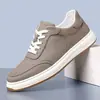 Tênis brancos masculinos 2026 primavera novos respiráveis casuais com cadarço na frente tênis esportivos versátil estilo minimalista sapatos masculinos