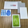 Kit de película para teléfono móvil Película templada Película hidráulica Película auxiliar Limpieza juego de tres piezas Kit de película nacarada