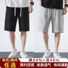 Shorts básicos casuales de color liso para hombre al por mayor, ajuste recto holgado, pantalones deportivos versátiles, pantalones de chándal ligeros, shorts hasta la rodilla