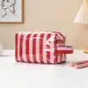 Bolsa de maquiagem listrada direto da fábrica, bolsa portátil de grande capacidade para armazenamento de batom, bolsa de higiene pessoal para viagem transfronteiriça