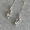 Pendientes de Borla de Perla Gris Hueca de Plata Retro de Moda Transfronteriza Europea y Americana Lujo Ligero Exquisitos de Moda Pendientes de Gama Alta