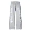 Calça de moletom estampada floral cruzada solta de perna larga para homens, vibe hip-hop moda de rua, calças de corte reto com design único