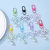 Pingente de chaveiro fofo e fresco de laço de bolinhas em resina DIY brinquedo de caixa cega decoração para capa de fone de ouvido bolsa