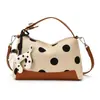Bolso bandolera de lunares estilo francés para mujer, bolso bandolera de hombro nuevo estilo coreano, versión coreana de bolso para mujer más vendido al por mayor