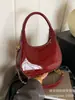 Bolsa Brilhante de Couro Patent 2026 Nova Moda Bolsa de Mão Tendência Transfronteiriça Pequena Bolsa Redonda de Ombro Bolsa Transversal com Corrente