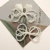 Japonés y Coreano Simple Versátil Perla Artificial Cristal Lazo DIY Bolsa Colgante para Teléfono Hebilla de Zapato Flor de Zapato Accesorios para Pendientes