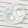 Chaveiro de aço inoxidável com desenho animado coreano de gato e peixe, pingente fofo para mochila, chaveiro de casal, novo, transfronteiriço