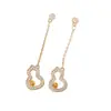 Nuevos y elegantes pendientes de perla tipo calabaza con borlas y montura calada para mujer, pendientes de alta gama, elegantes y a la moda al por mayor