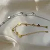 Pulseira de aço titânio dupla camada coração amoroso europeia e americana elegante moderna simples coração de pêssego banhada a ouro 18K pulseira feminina presente de feriado
