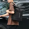 Mochila de negocios enrollable para hombre, nuevo modelo 2026, bolsa de viaje para computadora de gran capacidad, mochila estudiantil de color sólido a la moda