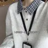 Sudadera retro americana a cuadros con cuello polo 2026 para hombre y mujer, otoño, corte holgado, estilo universitario, camiseta de manga larga de dos piezas falsas, moderna