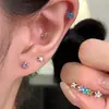 Pendientes de acero de titanio 316L brillantes mini de 4 mm con circonita de estrella para mujer, compactos de pentagrama en espiral para el lóbulo y la concha