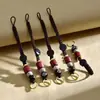 Hecho a Mano Bricolaje Cuerda Trenzada Cuerda Roja Cuerda Amarilla Patrón de Nube Borla Monedas de los Cinco Emperadores Llavero Colgante Accesorios Venta al por Mayor de Alta Gama