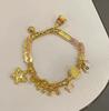 Pulsera china retro dorada de calabaza de diseño nicho de alto sentido cuerda roja antigua tejida a mano joyería al por mayor