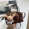 Bolso de mano de ante de nicho coreano para mujer, nuevo bolso de hombro para el día a día 2026, bolso versátil y elegante para el antebrazo