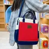 Nueva bolsa de tutoría para estudiantes con bloques de color estilo británico, bolsa cruzada impermeable de tela Oxford de gran capacidad para tutoría, bolsa de arte portátil