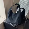 Bolsas de lona versátiles personalizadas de nicho para mujer, bolsos sencillos de un solo hombro de gran capacidad, bolsos de axila de diseño de nicho para mujer