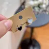 Pendientes de Corazón Doble Cara Blanco y Negro de Lujo Ligero y Gama Alta para Mujer, Diseño de Nicho, Elegantes de Moda, Pendientes Versátiles Simples y Pendientes