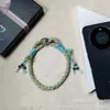 Lanyard de teléfono colorido tejido a mano, correa de muñeca de estilo étnico, cordón anti-pérdida con borla y cuenta, adorno colgante para funda de teléfono, venta al por mayor