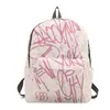 Fábrica de origen de comercio exterior estilo coreano graffiti nailon gran capacidad casual deportivo moderno mochila para estudiantes de secundaria