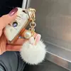 Puesto de Año Nuevo Artículos Pequeños Colgantes de Peluche Muñecos Pompones Lindos Llaveros Dijes para Bolsos Al por Mayor