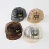 Al por mayor Otoño 2026 Lana Cálida Gorra de Pato para Bebé Estilo Coreano Serie a Cuadros para Niños y Niñas Sombrero de Ala Suave de Moda para Bebé