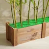 Instalações comerciais de bambu artificial, de 1,2m a 4,5m em vários tamanhos, adequadas para uso interno e externo em shoppings e showrooms.