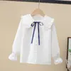 Camisa de menina Primavera e Outono nova camisa de algodão de manga comprida com gola de boneca para crianças médias e grandes camisa casual de moda para meninas