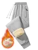 Pantalones gruesos de lana de cordero para hombre, pantalones largos extra gruesos con forro polar de invierno, pantalones de chándal de otoño e invierno, pantalones casuales con forro polar transfronterizos