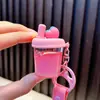 Llavero de taza de té con leche de frutas rellena de aceite lindo colgante de bolsa de arena movediza líquida pequeños accesorios de regalo al por mayor