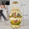 Tubo automático de palillos emergente con baño de color exclusivo transfronterizo para invitados Sala de Té restaurante tres fondo plano forma de huevo tubo de palillos Castillo