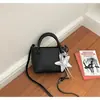 Bolso de mano simple y elegante, bolso pequeño para mujer, nuevo bolso tipo cubo 2026, moderno, versátil, con textura, bolso cruzado para dama miu