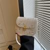 Bolso tejido para mujer 2024 nuevo bolso de flores de encaje a juego de moda bolso de sillín de moda de este año bandolera de hombro